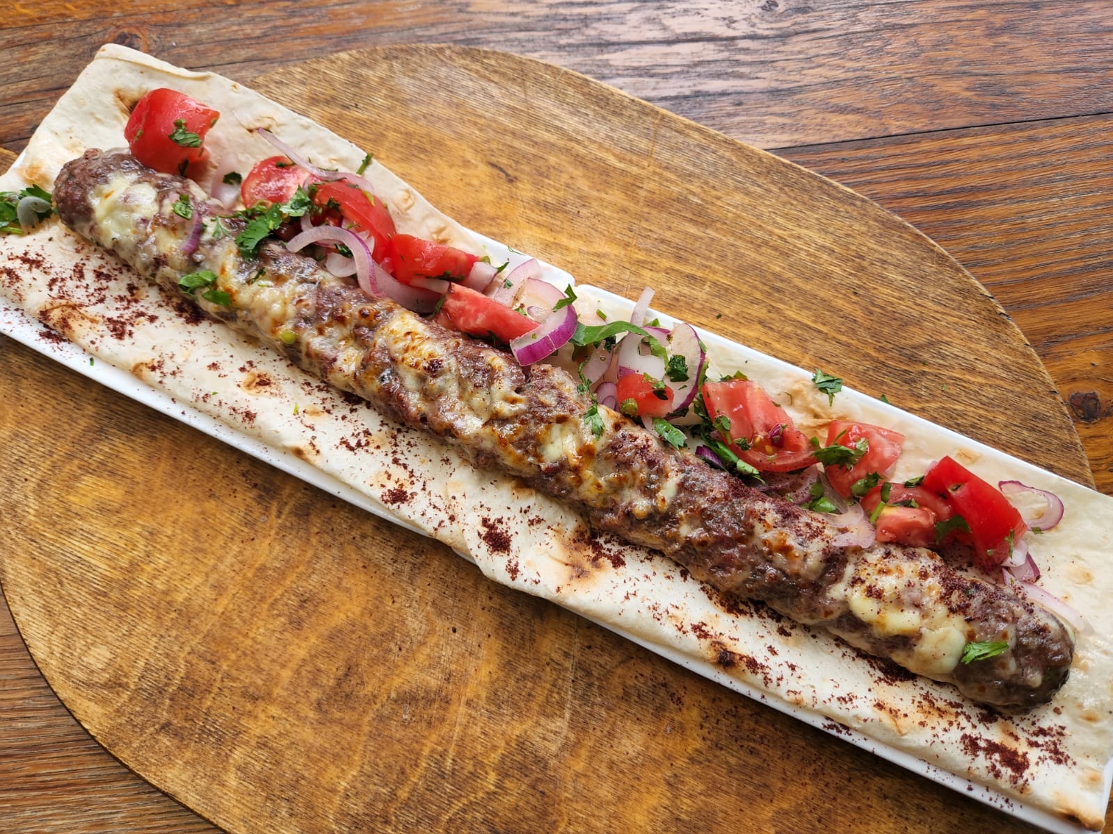 Branded Kebab with beef and sulguni at Tbilisuri Ezo Georgian restaurant in Tbilisi }}