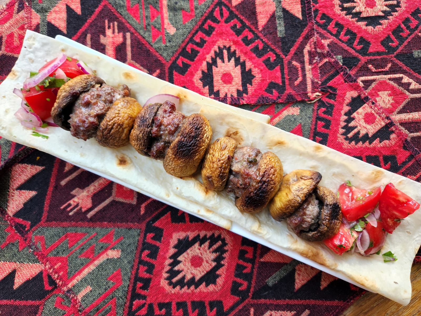 Chicken kebab with mushrooms at Tbilisuri Ezo Georgian restaurant in Tbilisi }}