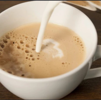 Instant coffee with milk at Tbilisuri Ezo Georgian restaurant in Tbilisi }}