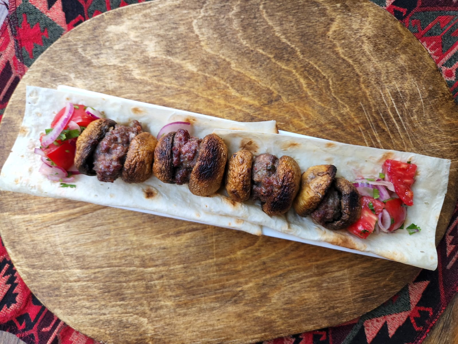 Beef kebab with mushrooms at Tbilisuri Ezo Georgian restaurant in Tbilisi }}